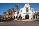 Basha's Main Market exterior view, showcasing its charming architecture and welcoming entrance lined with palm trees at 20795 W San Juan Ave, Buckeye, AZ 85396