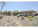 Spacious backyard featuring drought-tolerant landscaping, including a decorative rock feature at 2178 E Golf Ave, Tempe, AZ 85282