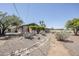 Landscaped yard with desert-style landscaping, gravel, and rock features at 2178 E Golf Ave, Tempe, AZ 85282