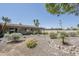 Landscaped backyard with desert-style landscaping, gravel, and mature desert plants and gravel feature at 2178 E Golf Ave, Tempe, AZ 85282