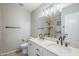 Bathroom with dual sinks, large mirror, and tiled shower/tub combo at 2178 E Golf Ave, Tempe, AZ 85282
