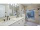 Bathroom with double sink vanity, walk-in shower, and stylish fixtures at 2178 E Golf Ave, Tempe, AZ 85282