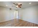 Bedroom featuring laminate flooring, ceiling fan, recessed lighting, and a connecting door to another room at 2178 E Golf Ave, Tempe, AZ 85282