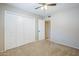 Bedroom with neutral carpet and a closet with folding doors at 2178 E Golf Ave, Tempe, AZ 85282