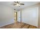 Bright bedroom features light walls, wood floors, and a large closet at 2178 E Golf Ave, Tempe, AZ 85282