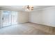 Bedroom with carpet, ceiling fan, and sliding glass door to outdoor area at 2178 E Golf Ave, Tempe, AZ 85282