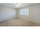 Bedroom with neutral carpet, a window with shade, and ample wall space for furniture and personal touches at 2178 E Golf Ave, Tempe, AZ 85282