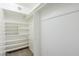 Walk-in closet with multiple shelves and hanging rods at 2178 E Golf Ave, Tempe, AZ 85282