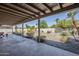 Spacious covered patio offering an open-air experience with access to the landscaped backyard at 2178 E Golf Ave, Tempe, AZ 85282