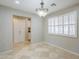 Dining area with a chandelier, natural light, and tile floors leading into the kitchen at 2178 E Golf Ave, Tempe, AZ 85282