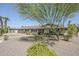 Charming one-story home features manicured landscaping, blue shutters, and a welcoming entrance at 2178 E Golf Ave, Tempe, AZ 85282