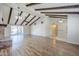 Bright living room with hardwood floors, brick fireplace, high ceilings, and sliding doors to the backyard at 2178 E Golf Ave, Tempe, AZ 85282