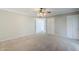 Spacious living room boasts neutral walls, carpet, and ample closet space at 2178 E Golf Ave, Tempe, AZ 85282