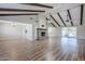 Spacious living room with wood floors, brick fireplace, and sliding glass doors at 2178 E Golf Ave, Tempe, AZ 85282