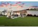 Expansive backyard features a patio, fire pit, bar area, and lush landscaping for outdoor enjoyment at 2225 N 38Th Way, Phoenix, AZ 85008