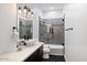 Chic bathroom with a modern vanity, sleek fixtures, and a glass-enclosed shower, perfect for relaxation at 2225 N 38Th Way, Phoenix, AZ 85008