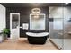 Luxurious bathroom with a freestanding tub, glass shower, and contemporary design for a spa-like experience at 2225 N 38Th Way, Phoenix, AZ 85008