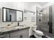Bathroom featuring gray tiling, shower, vanity and toilet at 2225 N 38Th Way, Phoenix, AZ 85008