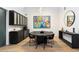 Contemporary dining room with statement art, modern lighting, and black dining set, perfect for entertaining at 2225 N 38Th Way, Phoenix, AZ 85008