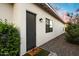 Exterior door to home with a green doormat and gravel landscaping at 2225 N 38Th Way, Phoenix, AZ 85008