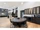 Spacious open-concept living area with modern finishes, including a dining area and sleek kitchen design at 2225 N 38Th Way, Phoenix, AZ 85008
