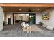 Outdoor patio area with a wood ceiling, TV, and sliding glass doors at 2225 N 38Th Way, Phoenix, AZ 85008