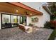 Covered patio area with wood ceiling, TV, and sliding glass doors at 2225 N 38Th Way, Phoenix, AZ 85008