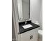 Renovated bathroom vanity featuring a black countertop and modern fixtures at 2233 E Behrend Dr # 29, Phoenix, AZ 85024