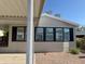 Close-up shot of home with three windows trimmed with black shutters at 2233 E Behrend Dr # 29, Phoenix, AZ 85024