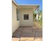 The side yard shows stone pavers for walking and is adjacent to the home and the adjacent carport at 2233 E Behrend Dr # 29, Phoenix, AZ 85024