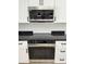 Close up of electric cooktop, stainless steel oven and stainless steel microwave at 2233 E Behrend Dr # 29, Phoenix, AZ 85024