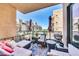 Outdoor balcony area with plenty of seating, a grill, and neighborhood views at 2302 N Central Ave # 311, Phoenix, AZ 85004