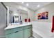 Bathroom featuring double sinks, a bath tub, shower, and stylish decor at 2302 N Central Ave # 311, Phoenix, AZ 85004