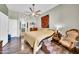 Spacious bedroom with hardwood floors, a large bed and stylish decor at 2302 N Central Ave # 311, Phoenix, AZ 85004