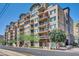 Attractive condominium with multiple floors, balconies, and greenery creates an inviting residential scene at 2302 N Central Ave # 311, Phoenix, AZ 85004