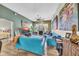 Spacious living room with hardwood flooring and comfortable blue seating area at 2302 N Central Ave # 311, Phoenix, AZ 85004