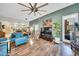 Bright living room features hardwood floors, modern ceiling fan, and colorful decor at 2302 N Central Ave # 311, Phoenix, AZ 85004