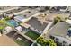 Aerial view of a home with a pool and a fenced backyard with artificial grass at 2313 N 87Th Way, Scottsdale, AZ 85257