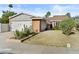 Charming single-story home with a well-maintained lawn and inviting curb appeal at 2313 N 87Th Way, Scottsdale, AZ 85257