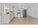 Well-lit kitchen featuring stainless appliances, ample counter space and modern light fixture at 2313 N 87Th Way, Scottsdale, AZ 85257