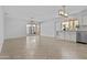 Open-concept living area with tile floors and sliding glass doors to the backyard at 2313 N 87Th Way, Scottsdale, AZ 85257