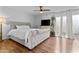Main bedroom featuring a large bed, hardwood floors, and natural light at 2313 N 87Th Way, Scottsdale, AZ 85257