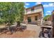 Backyard featuring covered patio, lush greenery, and outdoor cooking area at 242 N Crosscreek Dr, Chandler, AZ 85225