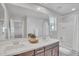 Bathroom featuring dual sinks, a shower-tub combo, and modern fixtures at 242 N Crosscreek Dr, Chandler, AZ 85225