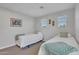 Bright bedroom offering two twin beds, neutral decor, and natural light at 242 N Crosscreek Dr, Chandler, AZ 85225
