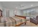 Spacious bedroom featuring large windows and an ensuite bathroom at 242 N Crosscreek Dr, Chandler, AZ 85225