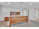 Spacious bedroom featuring a wooden bed frame and a nightstand at 242 N Crosscreek Dr, Chandler, AZ 85225