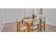 Cozy dining room with wood-style flooring and table set for six; perfect for Gathering meals at 242 N Crosscreek Dr, Chandler, AZ 85225