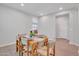 Charming dining room with table set for six, and wood-style flooring at 242 N Crosscreek Dr, Chandler, AZ 85225