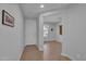 Welcoming entryway with wood flooring and a view into the home's bright living spaces at 242 N Crosscreek Dr, Chandler, AZ 85225